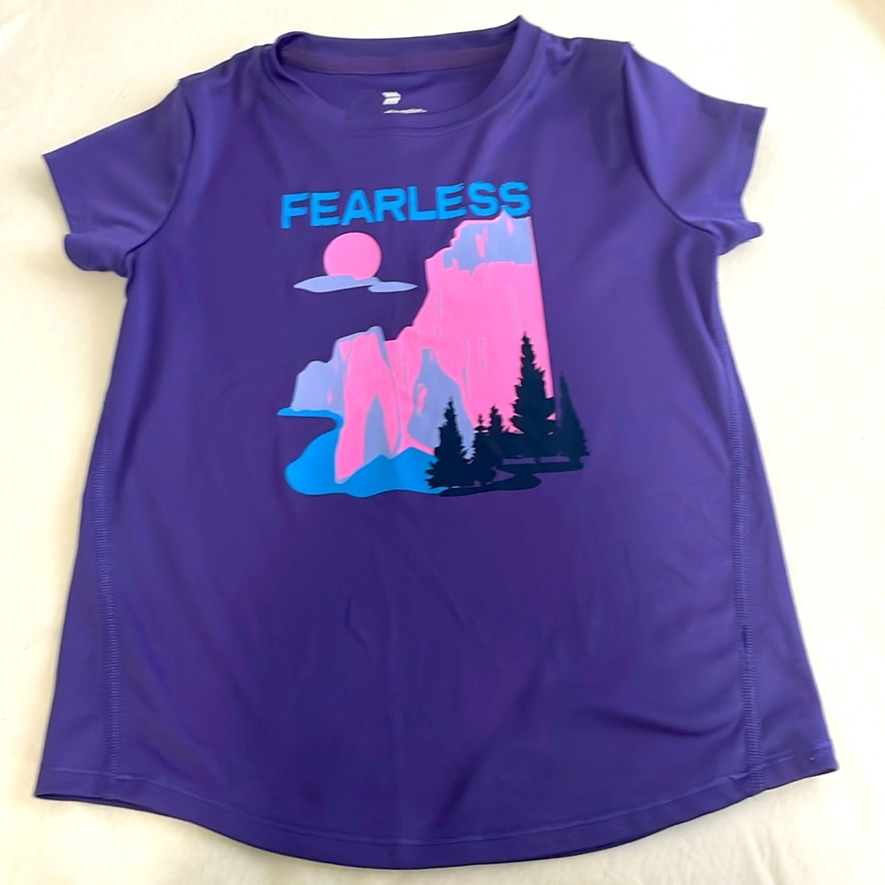 Purple T-shirt with laced sides  and with aqua lettering that says Fearless.